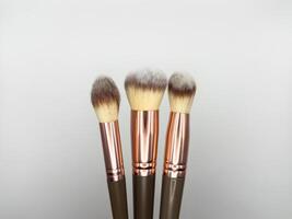 Make up brushes on the white background. copy space, flat lay, top view photo