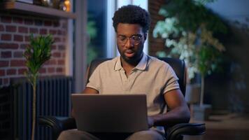 African American business man headache businessman tired worker typing laptop in night evening office late online work overtime busy deadline computer stress exhausted overwork employee problem health video