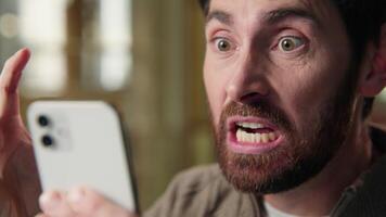Angry stressed annoyed business man scream mobile phone problem irritated Caucasian businessman guy male crazy shout yell emotion mad furious anger smartphone message crash negative in office close up video