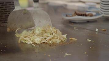 Cooking cabbage on a hot grill in a busy kitchen video