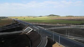 Highway interchange construction progressing over time. Clip video
