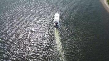 Aerial view of a boat traveling on the water video