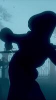 3d rndering. Death with a scythe, Grim Reaper, with red burning eyes in a graveyard in the fog, harvesting. Halloween concept. video
