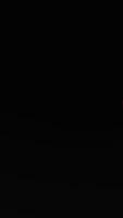 Red dice with white dots on black background reflection. video