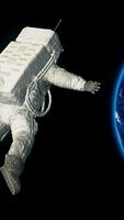 an astronaut floating in space near the earth video