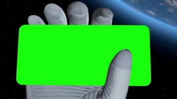 a hand holding a green card in front of the earth video