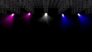 Multiple colorful stage spotlights illuminating a dark background from a metal truss structure. Bright pink, white, and blue light beams create a dynamic concert or event atmosphere. video