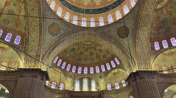 Blue Mosque , Sultan Ahmet, view inside the main hall, dome and stained glass windows video