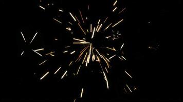 Golden Fireworks Bursts With Dynamic Motion Against A Black Background Sparkles Flare Magical Ambiance Celebratory Mood. seamless looping 4k animation background video