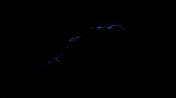 Isolated Blue Lightning Bolt on Black Background with Energetic Strike Illuminating the Night Sky. seamless looping 4k animation background video
