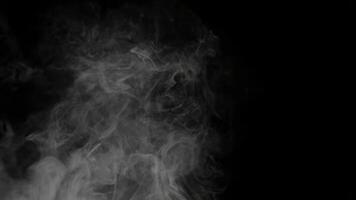 Ethereal White Smoke Texture Floating Against Black Background Creating an Atmospheric Effect for Compositing and Design Projects. seamless looping 4k animation background video