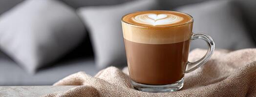 A latte with a heart on top of it photo