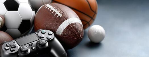 A variety of sports balls and a game controller photo
