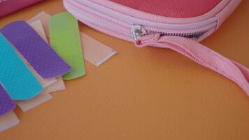 assorted band-aids in a first aid kit video
