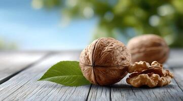 Walnuts and walnut shells on wooden table photo