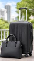 Black luggage and handbag on wooden table with city view photo