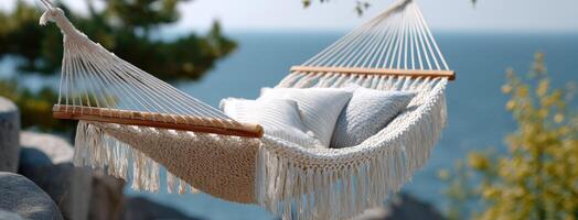 Relaxing in a hammock with fringes on a sunny beach with vibrant sea views, perfect for a serene getaway and scenic enjoyment photo