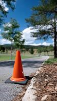 A traffic cone on the side of the road photo