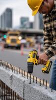 A man is using a drill to build a wall photo