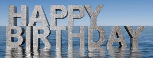 Happy birthday word in water with blue sky background photo