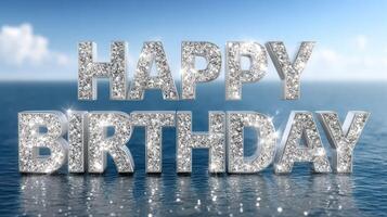 Happy birthday word in sparkling silver letters on blue water background photo