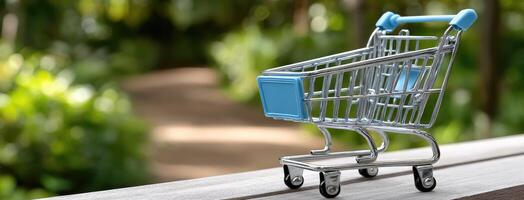 A small shopping cart is sitting on a wooden bench photo