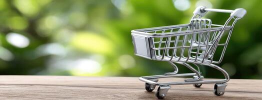 A small shopping cart on a wooden table photo