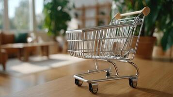 A small shopping cart is sitting on a table photo