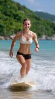 A woman riding a surfboard in the water photo