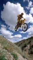 A person on a dirt bike in the air photo