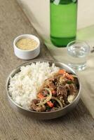Rice Beef Bulgogi on Silver Plate Bowl, Korean Style Food with Soju photo