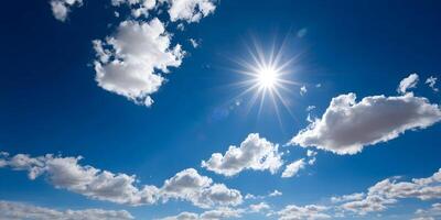 Fluffy white clouds floating in a bright blue sunny sky photo