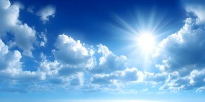 Fluffy clouds floating in a vivid blue sky on a sunny day photo