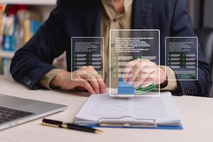 A business man is using a tablet to check his application photo