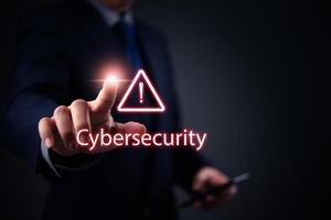 Cybersecurity concept - businessman hand pressing cyber security button on dark background photo