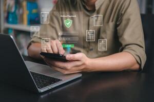 Man using smartphone and laptop with security icons photo