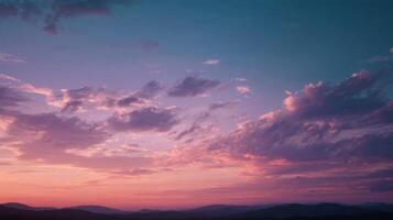 A Serene Dawn Scene with Pastel Colored Clouds photo
