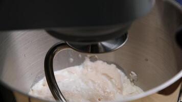 Close-up of Stainless Steel Stand Mixer Kneading Soft Dough in a Modern Kitchen Setting video
