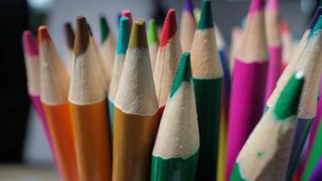 Vibrant colored pencils standing close together creating a creative art atmosphere video