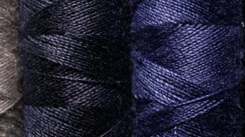 Close-up of Colorful Threads on Spools Displayed in a Textile Workshop Environment video