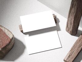 Stylish business card mockup with a stone base and wooden accents, creating a modern yet rustic look. photo