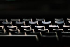 keys of a backlit pc keyboard on an Italian office desk photo