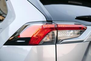 Close-up of car headlights of a new car. Automotive leasing and insurance. Automotive industry. The automobile leasing business. photo