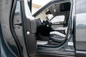 New, modern car close-up. Concept of renting or buying a new car and modern design. photo