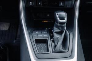 A close-up of the gearbox of a modern, new car. Concept of stylish design photo