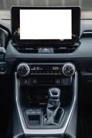A close-up of the gearbox of a modern, new car. Concept of stylish design, shopping, and car parts photo
