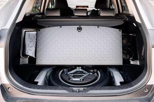 Spare wheel in the trunk of a modern car. photo