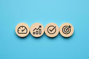 Four wooden buttons with icons on them photo