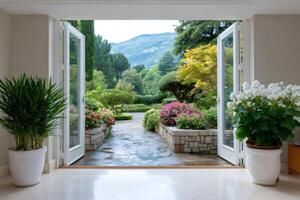 Open doors revealing beautiful garden with colorful flowers and mountain view photo
