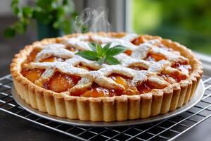 Freshly baked peach pie cooling on wire rack, steaming and dusted with icing sugar photo